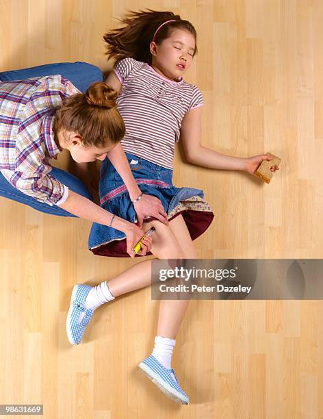 young woman administering epipen at home - adrenaline injection stock pictures, royalty-free photos & images