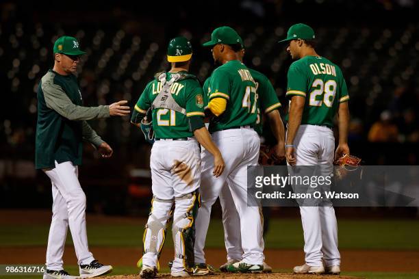 Frankie Montas of the Oakland Athletics is relieved by manager Bob Melvin during the eighth inning against the Kansas City Royals at the Oakland...