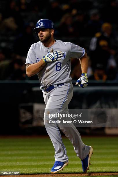 Mike Moustakas of the Kansas City Royals rounds the bases after hitting a home run against the Oakland Athletics during the eighth inning at the...