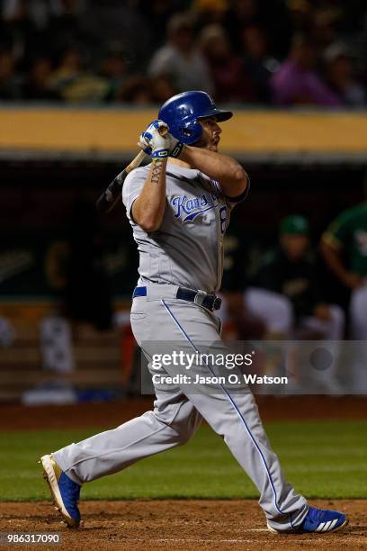 Mike Moustakas of the Kansas City Royals hits a home run against the Oakland Athletics during the eighth inning at the Oakland Coliseum on June 8,...