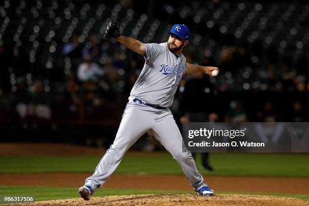 Brian Flynn of the Kansas City Royals pitches against the Oakland Athletics during the seventh inning at the Oakland Coliseum on June 8, 2018 in...