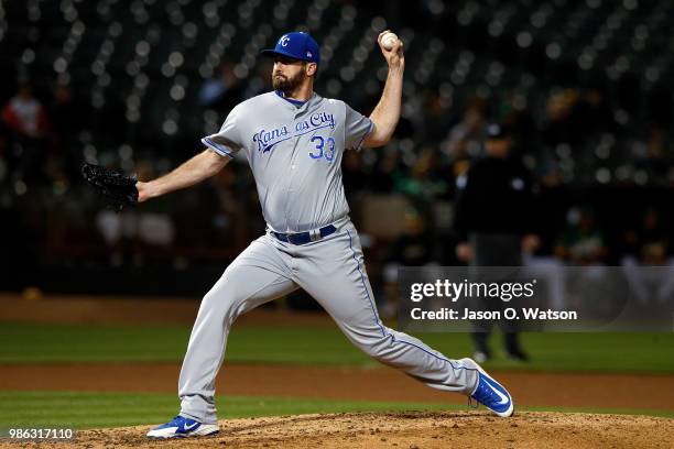 Brian Flynn of the Kansas City Royals pitches against the Oakland Athletics during the seventh inning at the Oakland Coliseum on June 8, 2018 in...