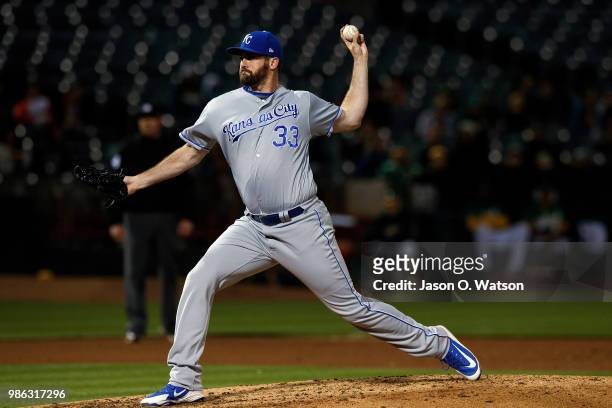 Brian Flynn of the Kansas City Royals pitches against the Oakland Athletics during the sixth inning at the Oakland Coliseum on June 8, 2018 in...
