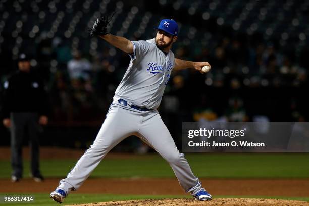 Brian Flynn of the Kansas City Royals pitches against the Oakland Athletics during the sixth inning at the Oakland Coliseum on June 8, 2018 in...