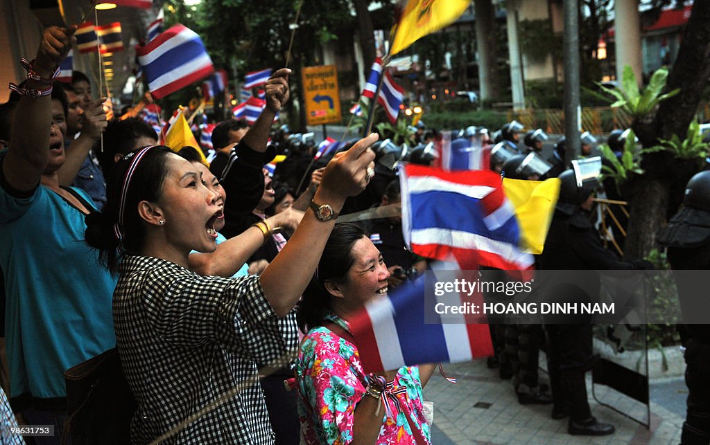 Thai pro-government protesters shout and