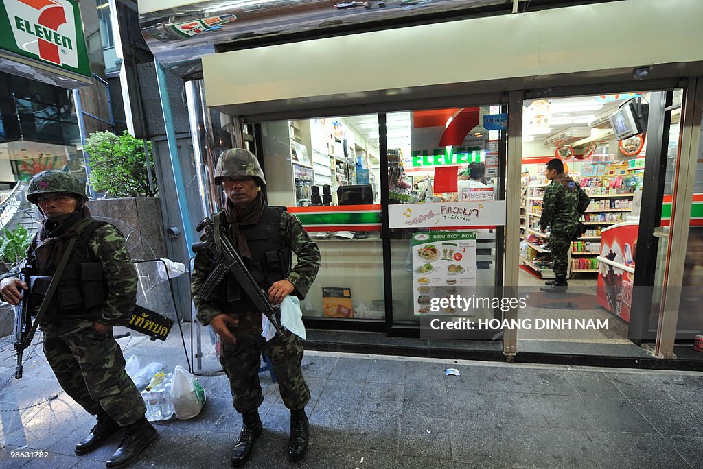 Thai soldiers stand guard outside a corn