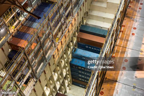 S Benjamin Franklin container ship being loaded at the Xiamen Songyu Container Terminal at night in Xiamen, China, on Saturday, Jan. 30, 2016. The...