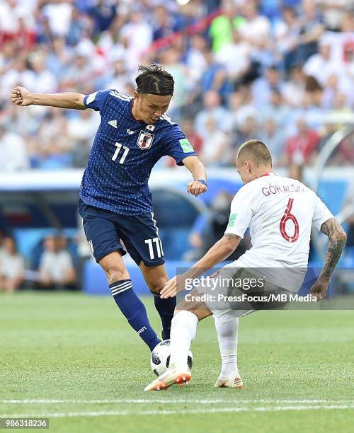 Takashi Usami of Japan competes with Jacek Goralski of Poland during the 2018 FIFA World Cup Russia group H match between Japan and Poland at...