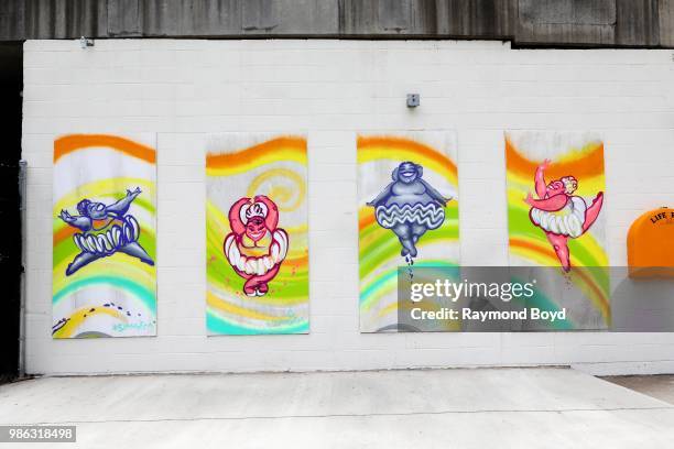 Artist Tyrue 'Slang' Jones' 'Ballerinas' canvas art pieces along the Chicago Riverwalk in Chicago, Illinois on June 23, 2018. MANDATORY MENTION OF...