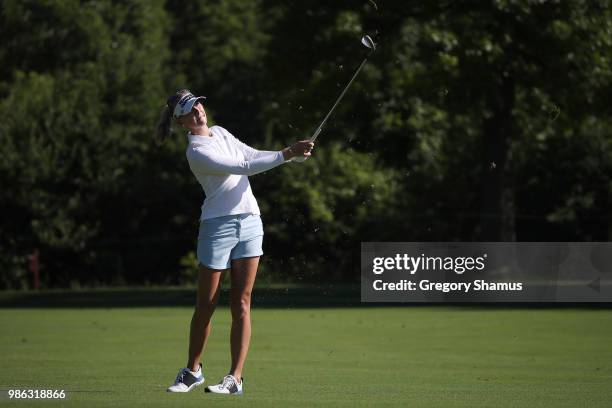 Jessica Korda hits her second shot on the first hole during the first round of the 2018 KPMG PGA Championship at Kemper Lakes Golf Club on June 28,...