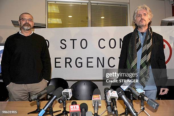 Italian aid workers Marco Garatti and Matteo Dell'Aira from the aid agency "Emergency" pose after answering journalists' questions during a press...