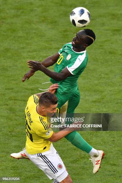Colombia's midfielder Mateus Uribe vies for the ball with Senegal's forward Sadio Mane during the Russia 2018 World Cup Group H football match...