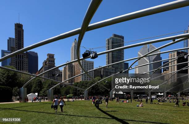 View looking into Downtown Chicago, as photographed from The Great Lawn under architect Frank Gehry's Jay Pritzker Pavilion in Millennium Park in...