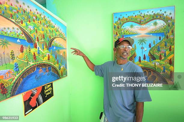 Haitian artist Raymond Bauduy paints the earthquake on April 23, 2010 in Peguy-ville a suburb of Port au Prince. Unlike some of Haiti's painters, it...