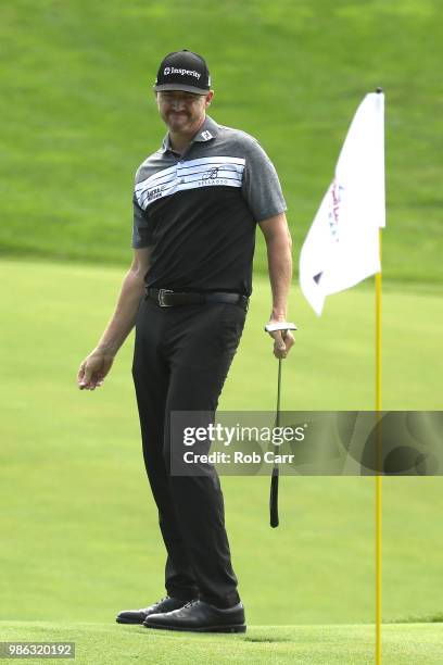 Jimmy Walker reacts to a putt on the 15th green during the first round of the Quicken Loans National at TPC Potomac on June 28, 2018 in Potomac,...