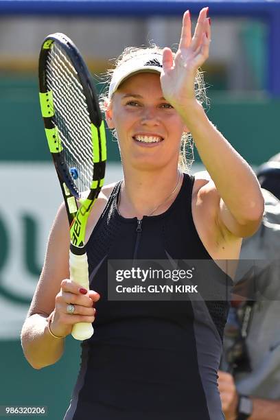 Denmark's Caroline Wozniacki celebrates her victory over Australia's Ashleigh Barty after their women's singles quarter final match at the ATP Nature...