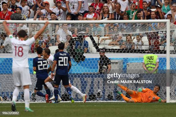 Poland's defender Jan Bednarek celebrates after scoring the opener past Japan's goalkeeper Eiji Kawashima during the Russia 2018 World Cup Group H...