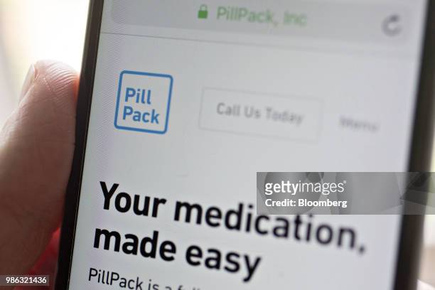 The PillPack website is displayed on an Apple Inc. IPhone in an arranged photograph taken in Washington, D.C., U.S., on Thursday, June 28, 2018....