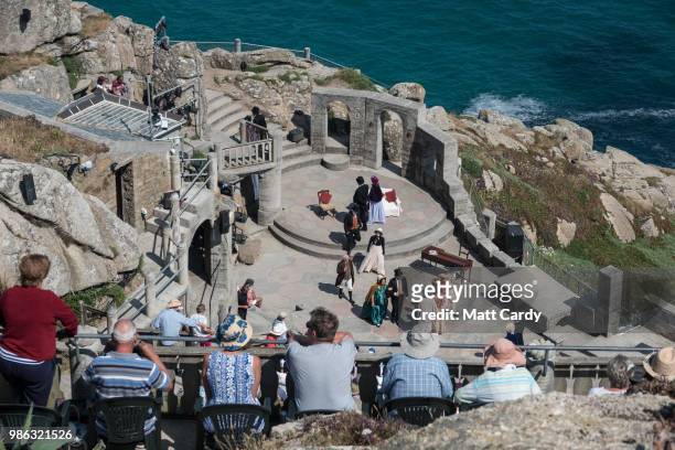 People watch a show at the Minack Theatre near Penzance on June 28, 2018 in Cornwall, England. Parts of the UK are continuing to experience heatwave...