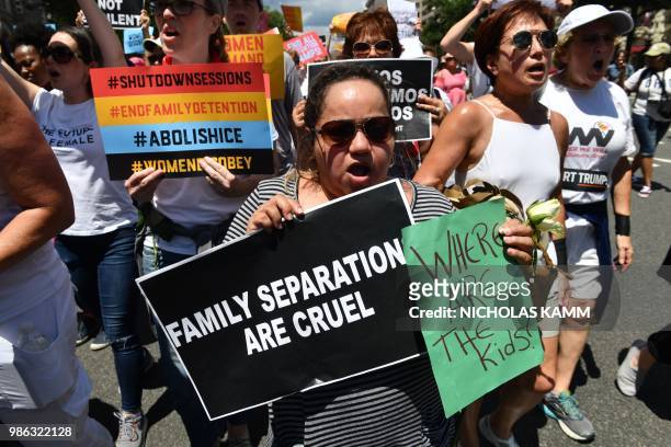 People demonstrate in Washington, DC, on June 28 demanding an end to the separation of migrant children from their parents. - US President Donald...