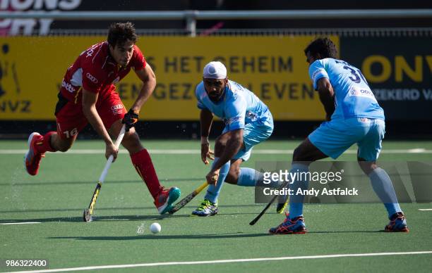 Alexander Hendrickx from Belgium, is challanged by Simranjeet Singh, and Amit Rohidas from India during the India versus Belgium Men's Rabobank...