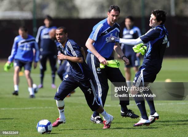 Ashley Cole and Yury Zhirkov of Chelsea in action during a training session at the Cobham Training Ground on April 23, 2010 in Cobham, England.