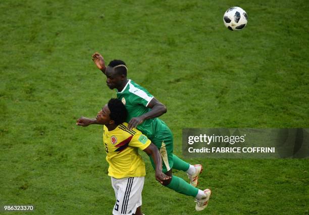 Colombia's midfielder James Rodriguez vies for the ball with Senegal's forward Sadio Mane during the Russia 2018 World Cup Group H football match...