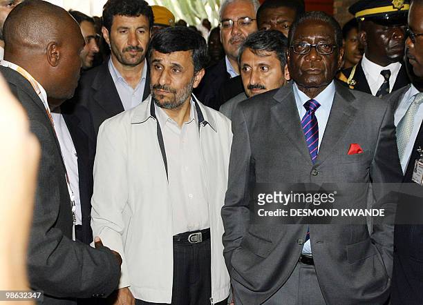 Zimbabwean President Robert Mugabe and Iranian President Mahmoud Ahmadinejad attend the official opening of the international trade fair on April 23...