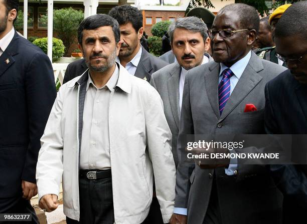 Zimbabwean President Robert Mugabe and Iranian President Mahmoud Ahmadinejad attend the official opening of the international trade fair on April 23...