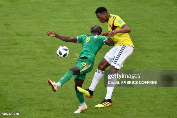 Senegal's forward Sadio Mane vies for the ball with Colombia's defender Yerry Mina during the Russia 2018 World Cup Group H football match between...