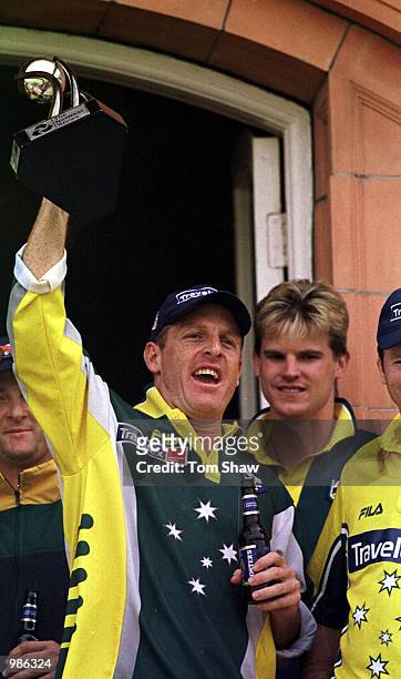 Wade Seccombe of Australia raises the trophy after Australia won the Natwest Triangular Series Final between Australia and Pakistan played at Lord's...
