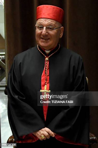 New Cardinal Louis Raphael I Sako of Iraq poses as he attends the courtesy visit of relatives following a consistory for the creation of new...