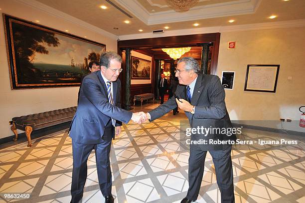 Italian ex-premier Romano Prodi meet publisher Carlo De Benedetti during the conference of Prometeia at hotel Carlton on April 23, 2010 in Bologna,...