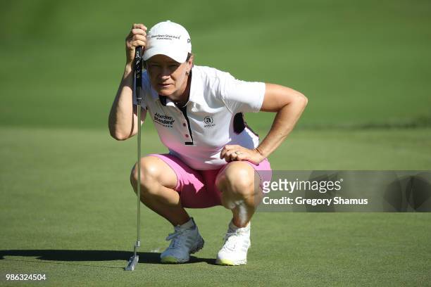 Catriona Matthew of Scotland reads a putt on the first green during the first round of the 2018 KPMG PGA Championship at Kemper Lakes Golf Club on...