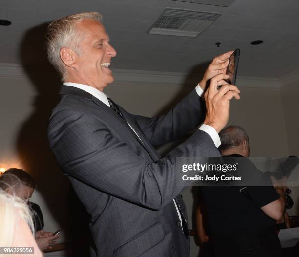 Actor Patrick Fabian takes photos of costar Rhea Seehorn backstage at the Academy Of Science Fiction, Fantasy & Horror Films' 44th Annual Saturn...