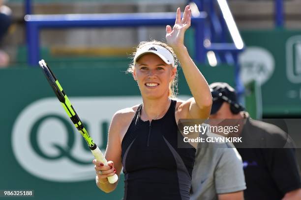 Denmark's Caroline Wozniacki celebrates her victory over Australia's Ashleigh Barty after their women's singles quarter final match at the ATP Nature...