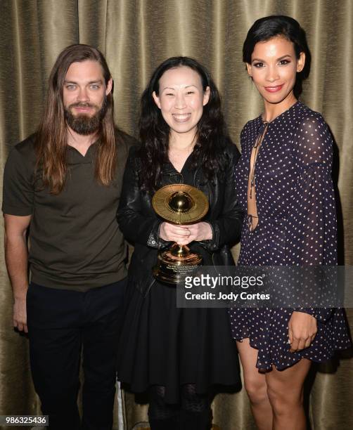 Actor Tom Payne, producer Angela Kang and actress Danay Garcia pose backstage at the Academy Of Science Fiction, Fantasy & Horror Films' 44th Annual...