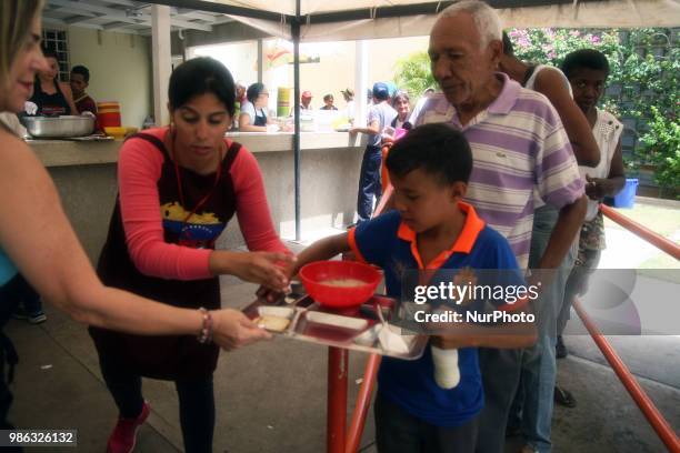 More than 1000 people, including children, adults, the elderly and the indigent, attend on June 27, 2018 in Maracaibo, Venezuela. To the Padre Claret...