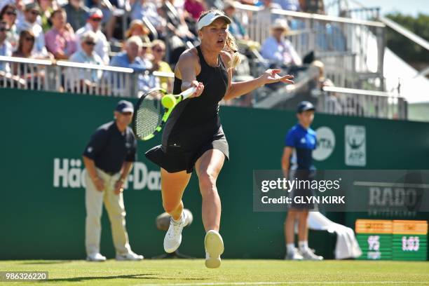 Denmark's Caroline Wozniacki returns to Australia's Ashleigh Barty during their women's singles quarter final match at the ATP Nature Valley...