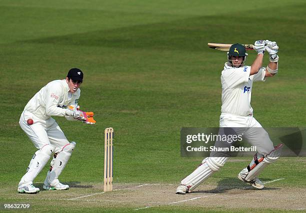 Mark Wagh of Nottinghamshire plays as shot as Craig Kieswetter the somerset wicketkeeper looks on during the LV County Championship match between...