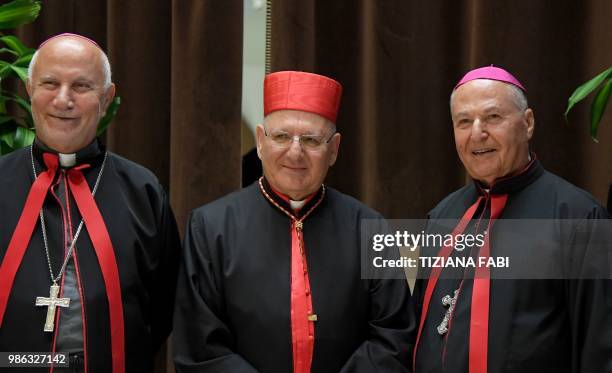 New Cardinal Louis Raphael I Sako of Iraq poses with bishops as he attends the courtesy visit of relatives following a consistory for the creation of...