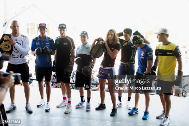 The MotoGP riders pose during the pre-event "MotoGP riders will get a lesson of self-defense, with Dutch Kickboxing World Champion Sarel de Jong and...