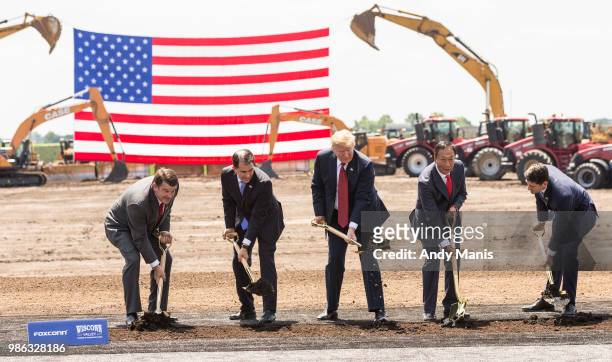 President Donald Trump breaks ground with Wisconsin Gov. Scott Walker , Foxconn CEO Terry Gou , U.S. House Speaker Paul Ryan and Christopher “Tank”...