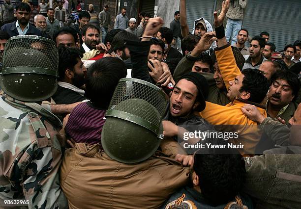 Indian police officers scuffle with the leaders and activists of Jammu and Kashmir Liberation Front , a separatist party fighting for independence of...