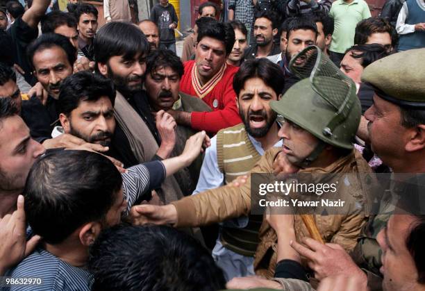 Indian police officers scuffle with the leaders and activists of Jammu and Kashmir Liberation Front , a separatist party fighting for independence of...