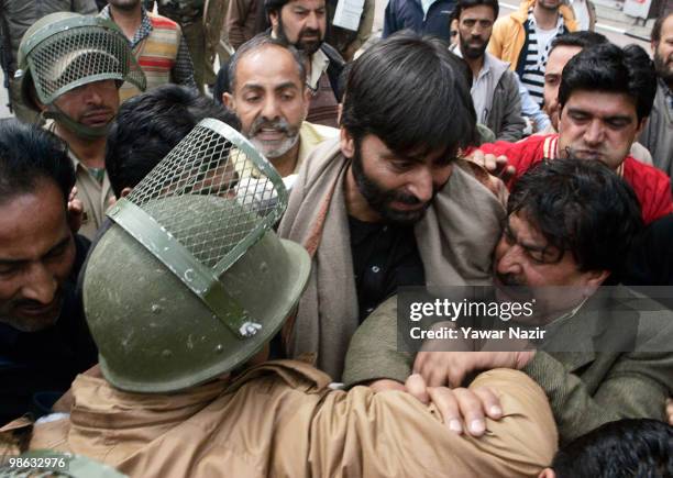 Indian police officers scuffle with the leaders and activists of Jammu and Kashmir Liberation Front , a separatist party fighting for independence of...
