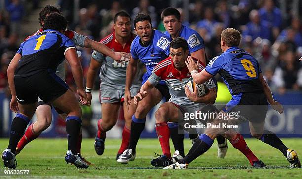 Daniel Carter of the Crusaders looks to evade a tackle during the round 11 Super 14 match between the Western Force and the Crusaders at ME Bank...