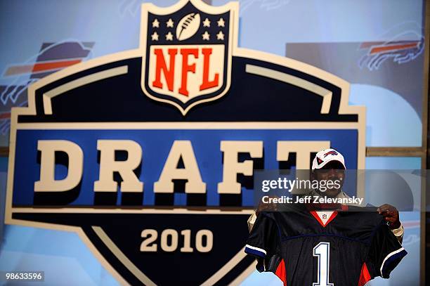 Spiller from the Clemson Tigers holds up a Buffalo Bills jersey after he was selected number 9 overall by the Bills during the first round of the...