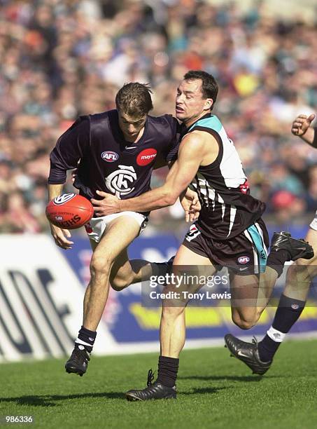 Matthew Lappin of Carlton and Brett Montgomery of Port in action in the match between Port Power and the Carlton Blues in round 12 of the AFL played...