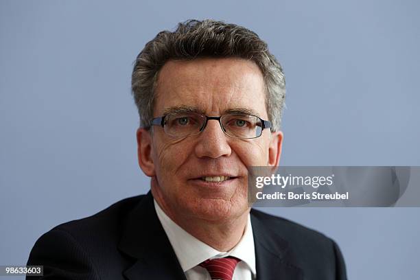 Thomas de Maiziere, German Interior Minister attend the press conference after the round table discussion on the subject of 'Gewalt im Zusammenhang...